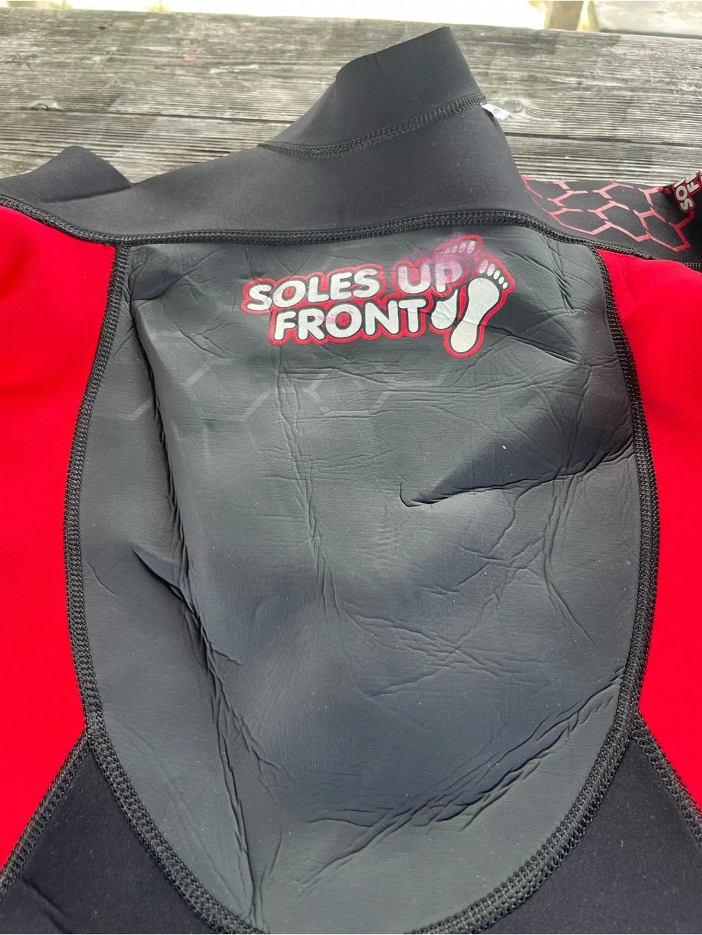 Kids Black and Red Wetsuit -soles up front 10/12 approx